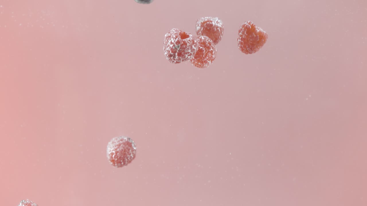 Raspberries Falling in Water
