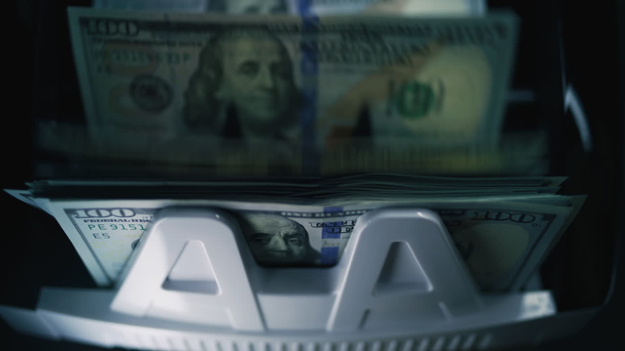 Stack of US Money in a Bill Counter