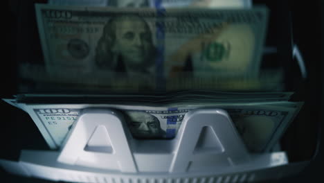 stack of us money in a bill counter