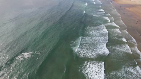 aerial shot of the ocran wawes, portugal