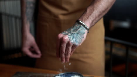 male-latin-model-slow-motion-hand-with-sea-salt-throw-up