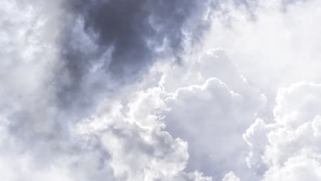 close up of dark white cumulus clouds in the sky