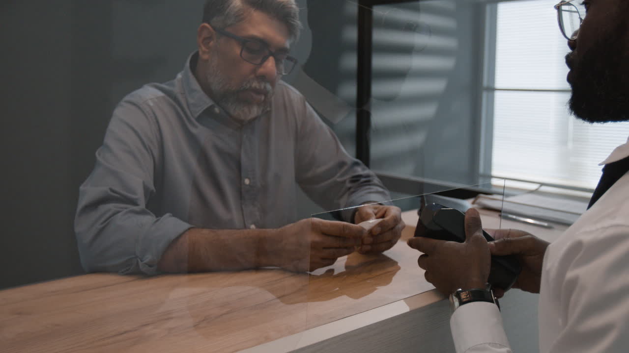 Patient Consultation with Protective Barrier