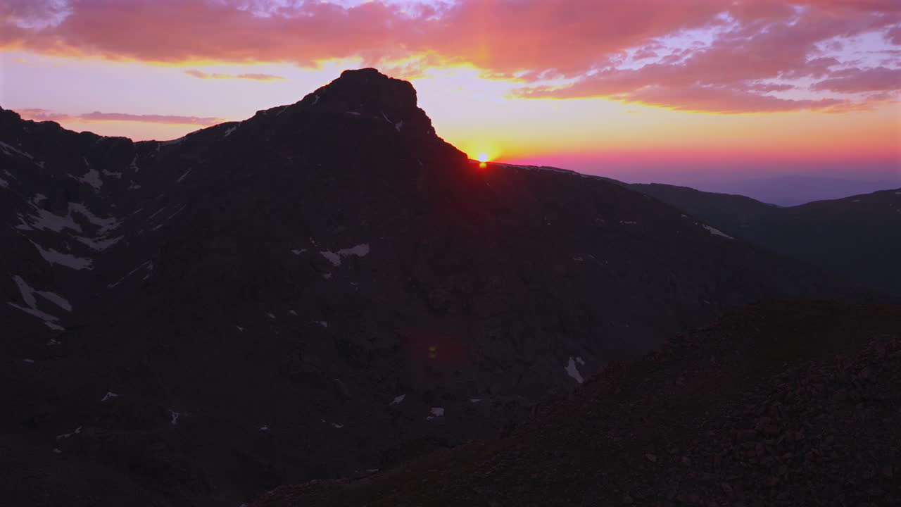 Mount of the Holy Cross Halo Ridge Colorado 14er peak Sawatch Range aerial drone Vail Minturn golden hour vibrant sunset on Rocky Mountains horizon Notch Mountain shelter circle right