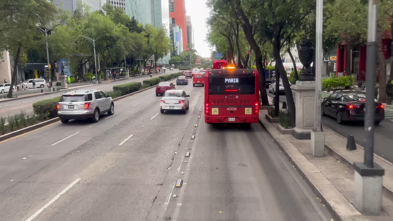 Slow motion shot of public transport system in mexico city in from of senate