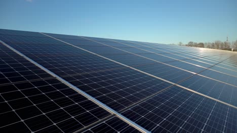 solar farm solar panels producing electricity on sunny day, camera pan