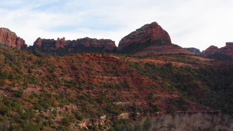 Mountain-valley-with-forest-land-at-Sedona,-Arizona---establishing-drone-flying-shot