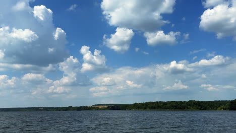 lovely nature scenery on sunny summer day. footage above the river under the beautiful blue cloudy sky.
