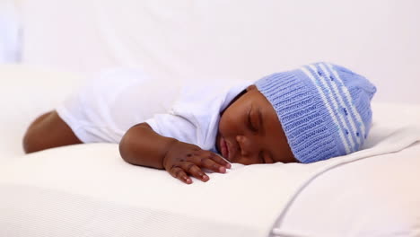 Baby-boy-sleeping-in-crib-