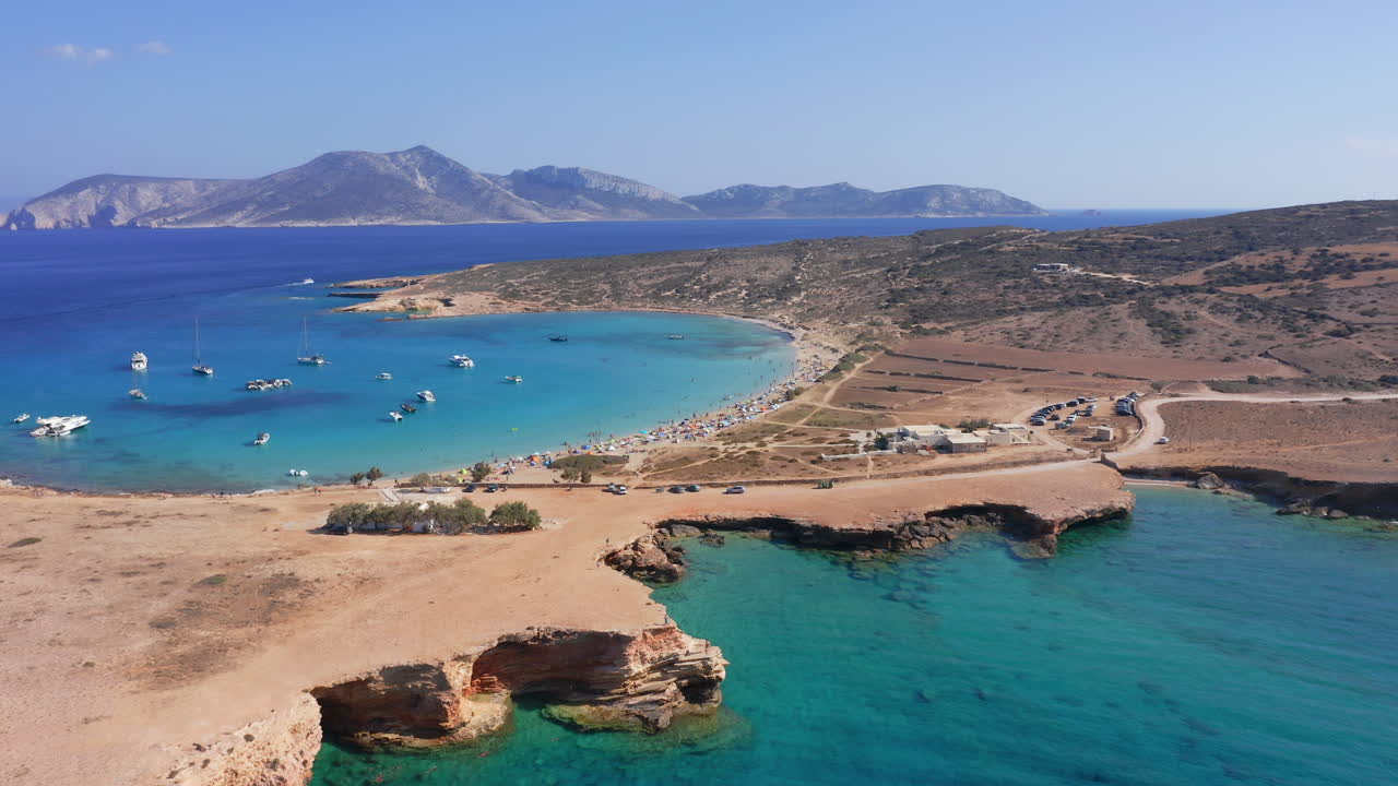 Turquoise sea fills inlet near Ksylompatís Caves and beach shore of Koufonisia, Greece