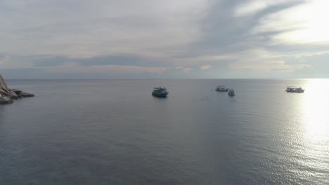 tranquil scene of boats anchored in a calm ocean