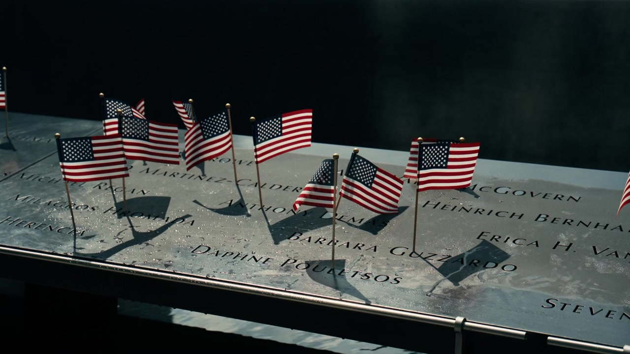 Wide row of miniature flags along memorial edge