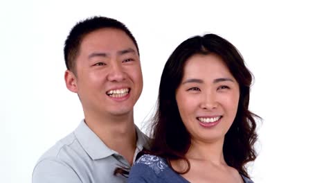 Portrait-of-Asian-smiling-couple-hugging