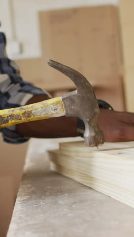 african american man working on a carpentry project at home