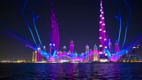 glowing dubai skyscrapers illuminating nocturnal cityscape, reflecting luminous architectural silhouettes across tranquil waterfront under starry night sky