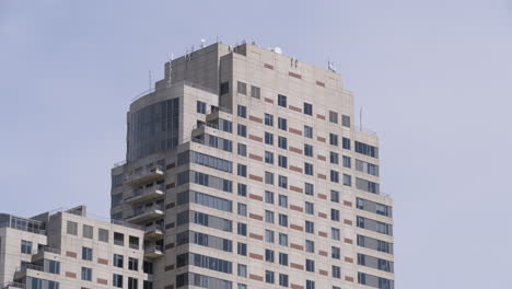 telephoto shot of the top of a large building in downtown grand rapids, michigan