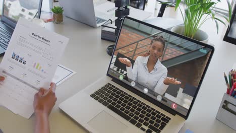 African-american-businesswoman-using-laptop-for-video-call-with-african-american-business-colleague