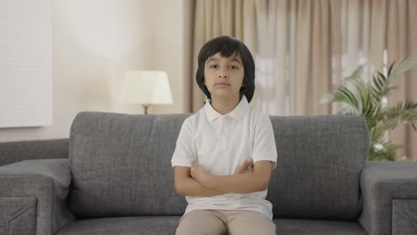 serious indian boy looking at the camera