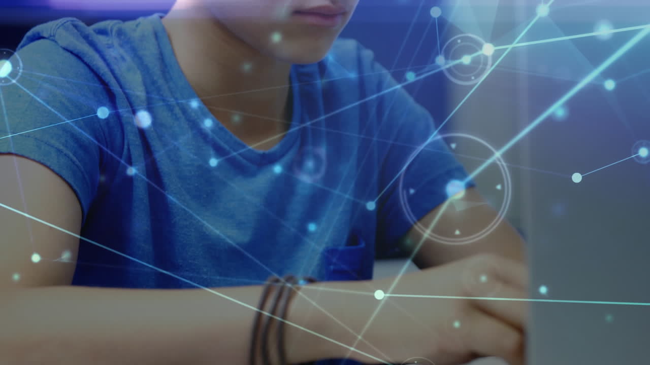 Animation of networks of connections with icons over schoolboy using laptop