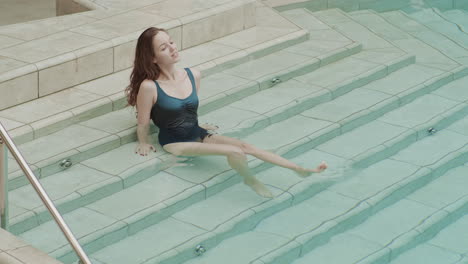 woman sitting in pool