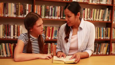 Teacher-explaining-something-to-her-pupil