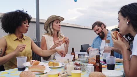people having an outdoor meal