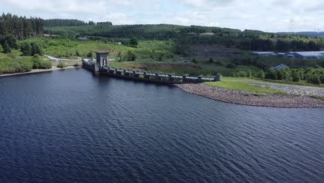 alwen reservoir welsh woodland lake water supply aerial view concrete dam countryside park orbit wide right push in