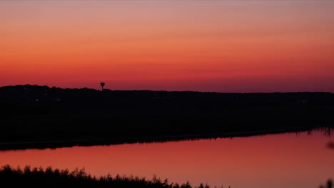 dramatic, colorful timelapse of the twilight just after sunset in canon lake, texas in the hill country