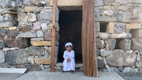 arab kid in arabian traditional house made with stone