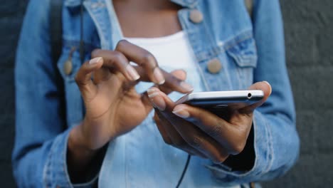 woman using mobile phone in the city 4k