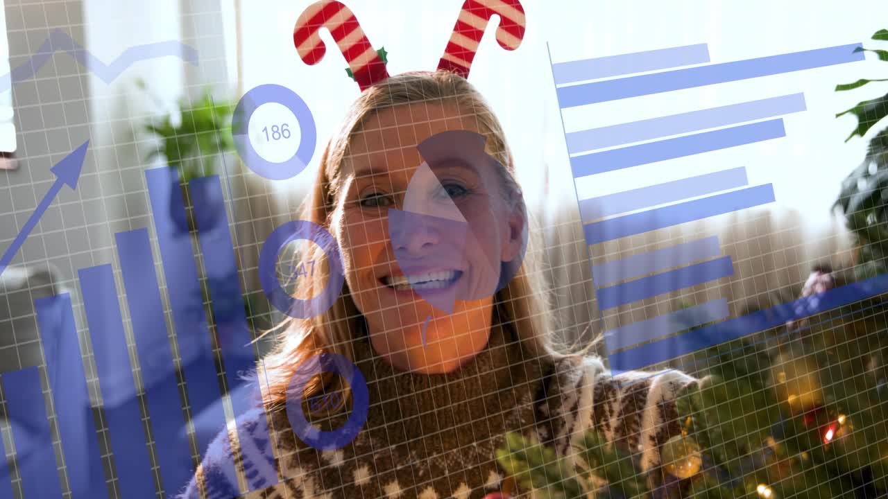 Mature woman picking red bauble placing on fir tree for business blue charts hovering over scene