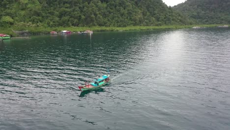 Beautiful-View-Of-The-Billies-Surrounding-The-Boat-On-Sail-On-Mursala-Island-In-Sibolga,-North-Sumatra,-Indonesia