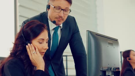 business people wearing headset working in office