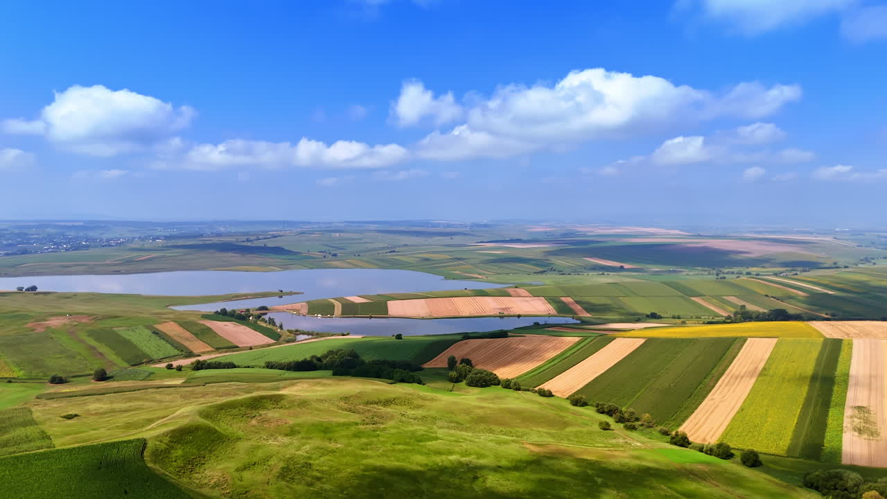 Golden and green fields panorama. Aerial view of farmland in Romania with yellow crops and green fields