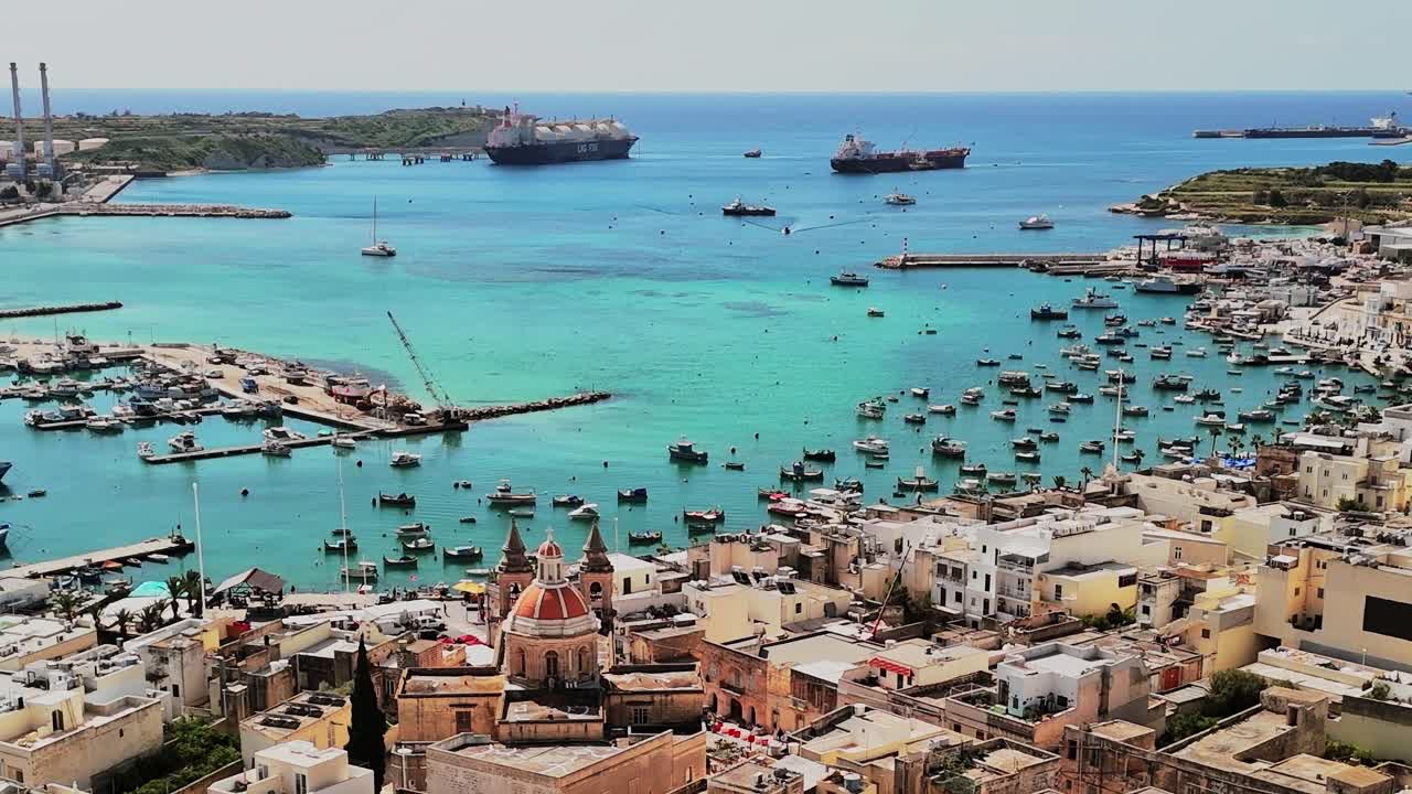 View of boats and ships in Malta's harbor during the day