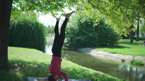 Woman-doing-Supported-headstand-in-park