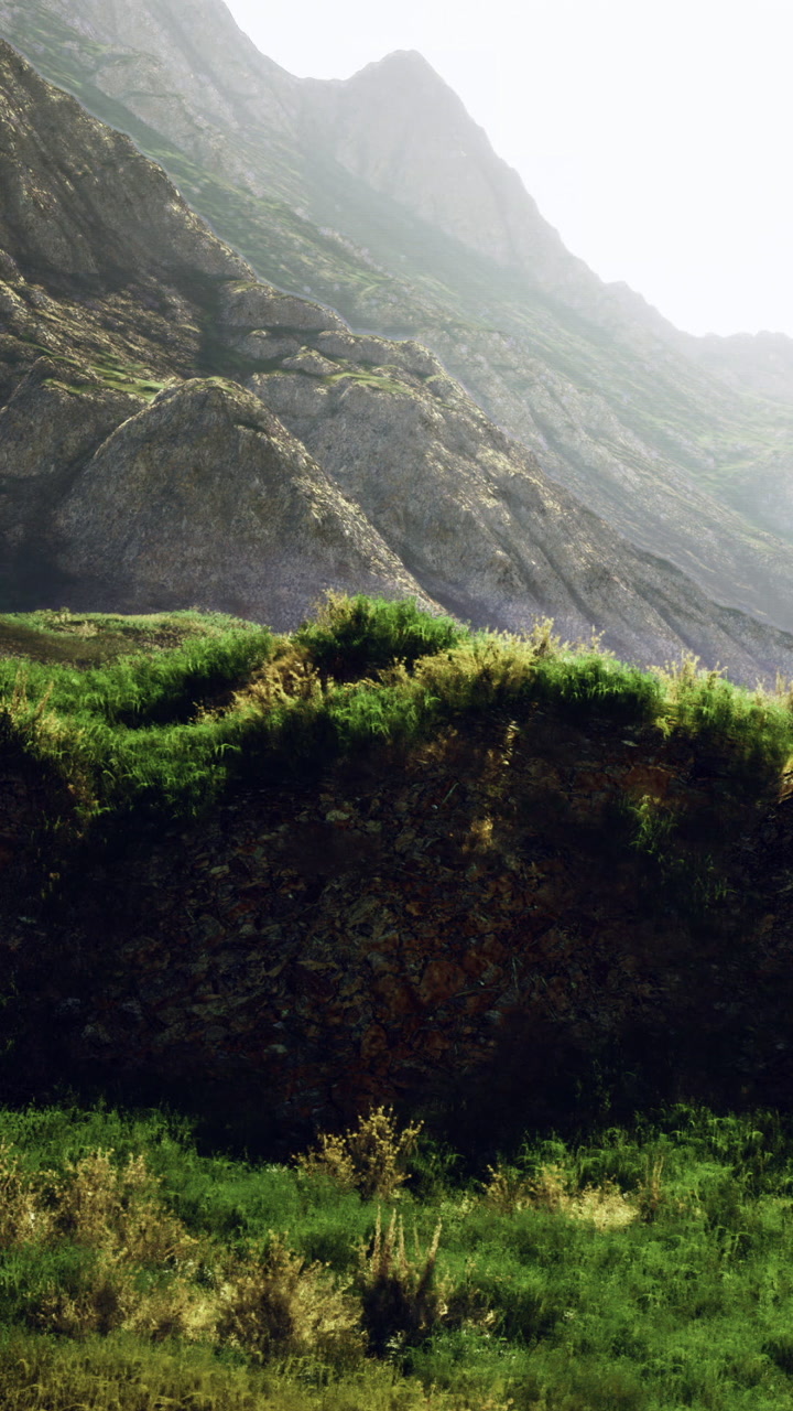 Mountains and green hills create a landscape in a remote area during daytime