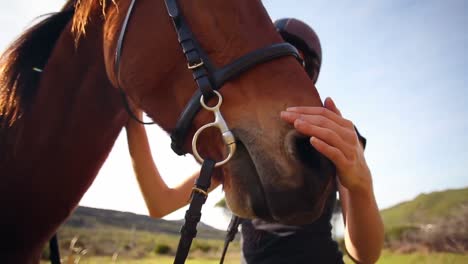 pretty woman standing next to horse