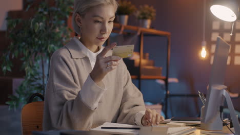 woman working from home and celebrating online success