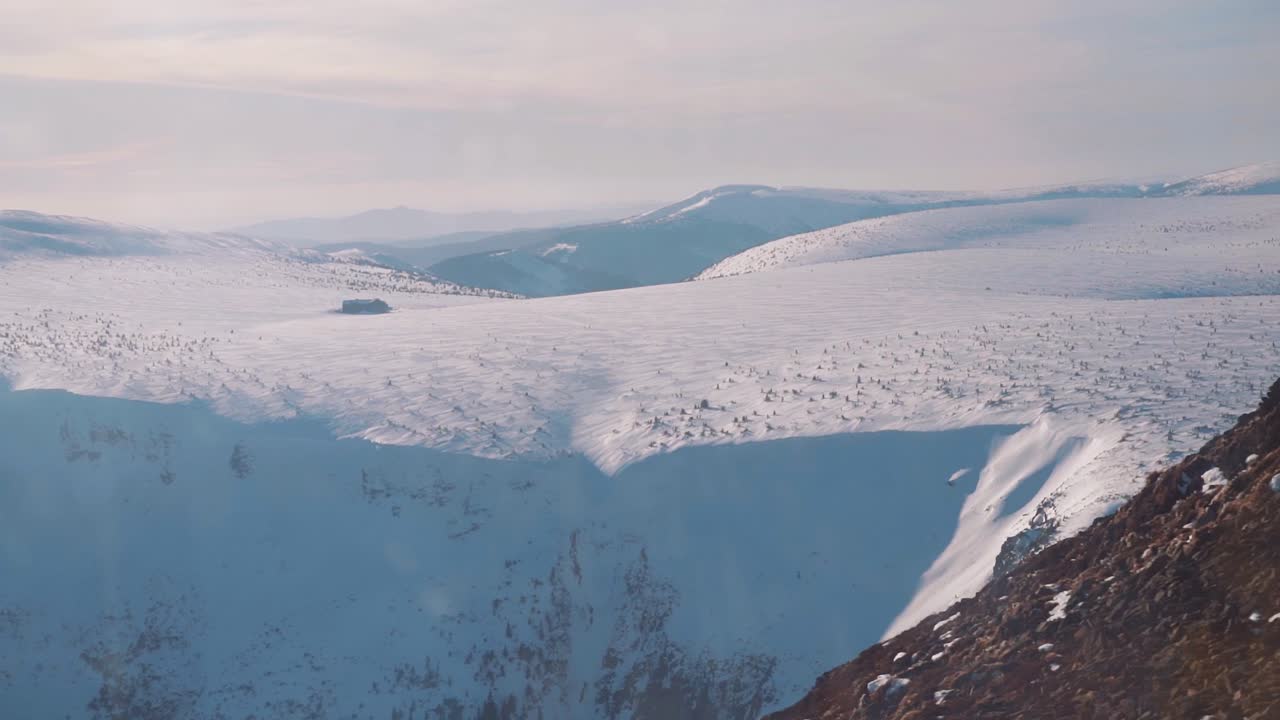 View of snowy mountains from frozen mountain top, krkonose, czechia, europe
