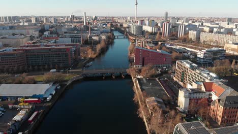 berlin wall from the river spree with a drone flying along the river and showing the berlin tv antenna made in 4k 24fps