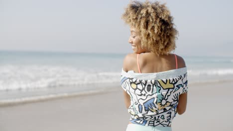 Positive-Young-Woman-On-The-Beach