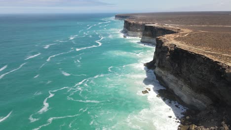 Drone-aerial-moving-down-with-pan-up-over-the-Great-Australian-Bight-showing-crashing-waves