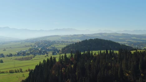 vast pastures by zakopianka highway and majestic tatra mountains poland, aerial
