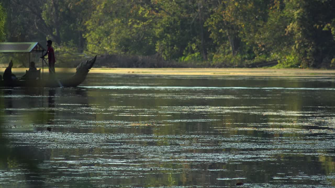 Wide Exterior Static Shot of Boat Sailing in the River With Passengers in the Day