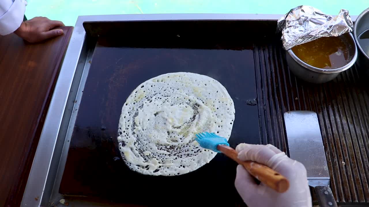 close up of cooking traditional indian food Dhosa