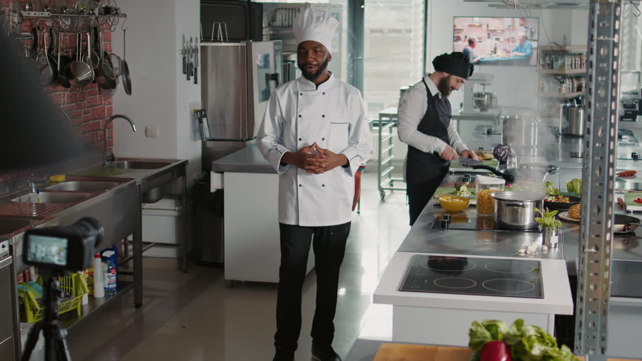 African american cook filming cooking show vlog on camera