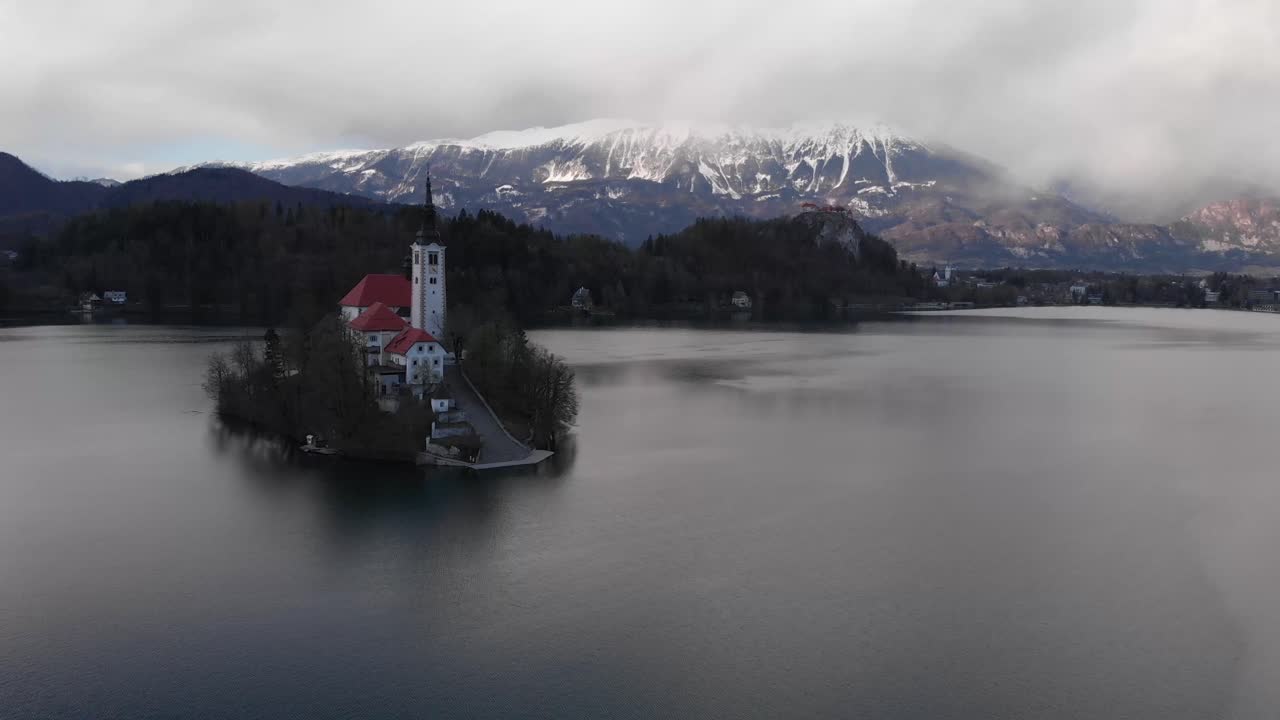 Most famous Slovenian lake and island Bled. Aerial view of Island in Bled Lake. Bled Castle in background. Lake Bled with castle, Slovenia, Europe.