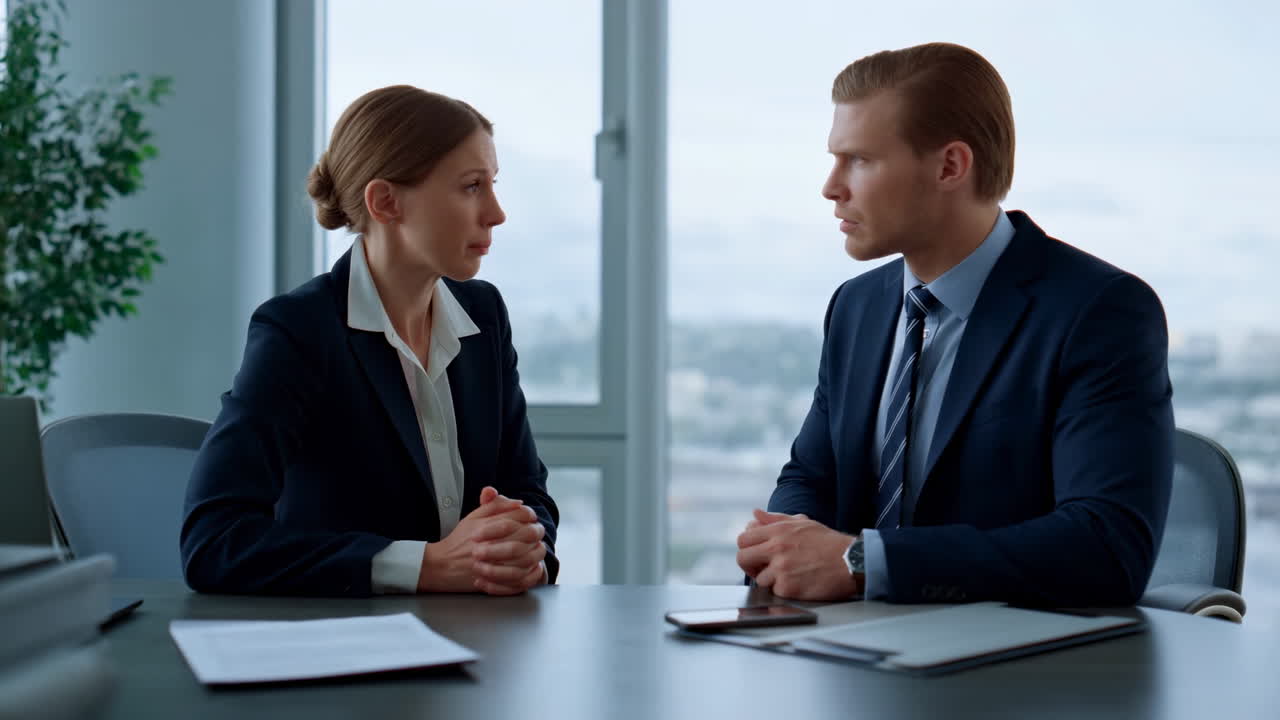 Two Professionals In Office Meeting, Female HR Manager And Male CFO Review Contract And Paperwork, Tablet