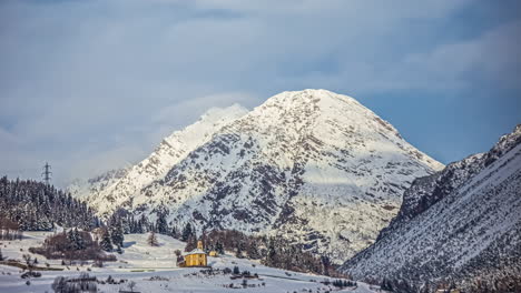 Time-lapse-of-clouds-and-snow-clad-mountains-while-blue-sky-in-the-background